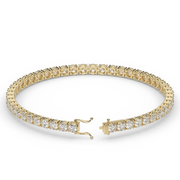 6 Carat Yellow Gold Round Shape Diamond Tennis Bracelet With Prong Setting.